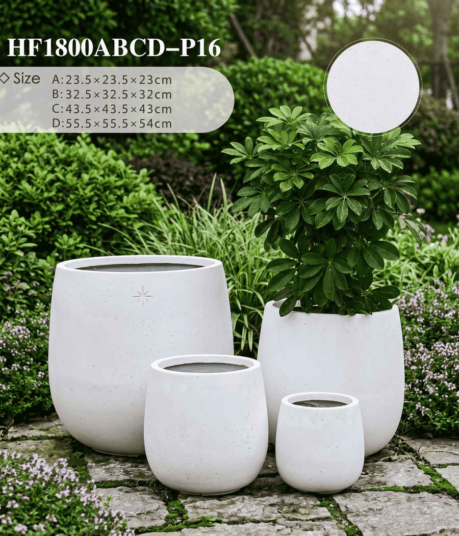 The Tapered Series alabaster white cone-shape planters on a modern patio