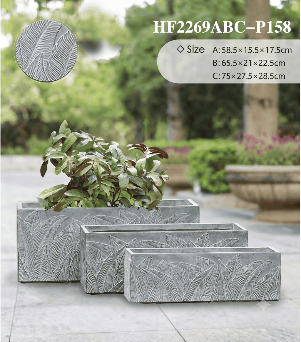 Palm leaf rectangular planter featuring an embossed botanical pattern in a modern setting
