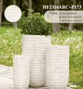 Honeycomb textured planters pots showcasing a unique hexagonal pattern in a modern living space