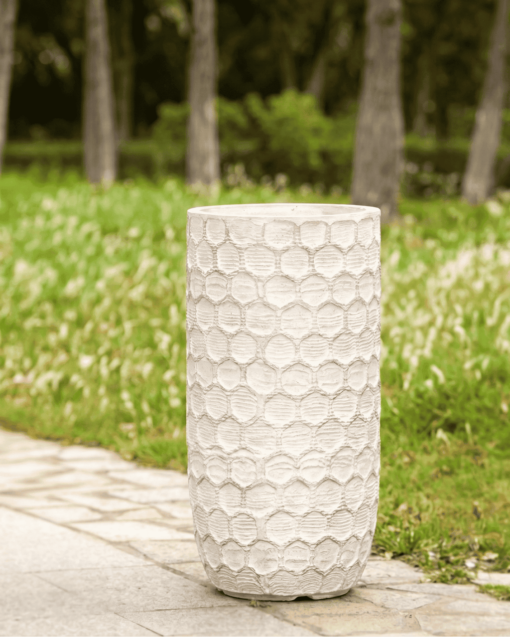 Durable honeycomb textured planters pots styled elegantly on a bright patio deck