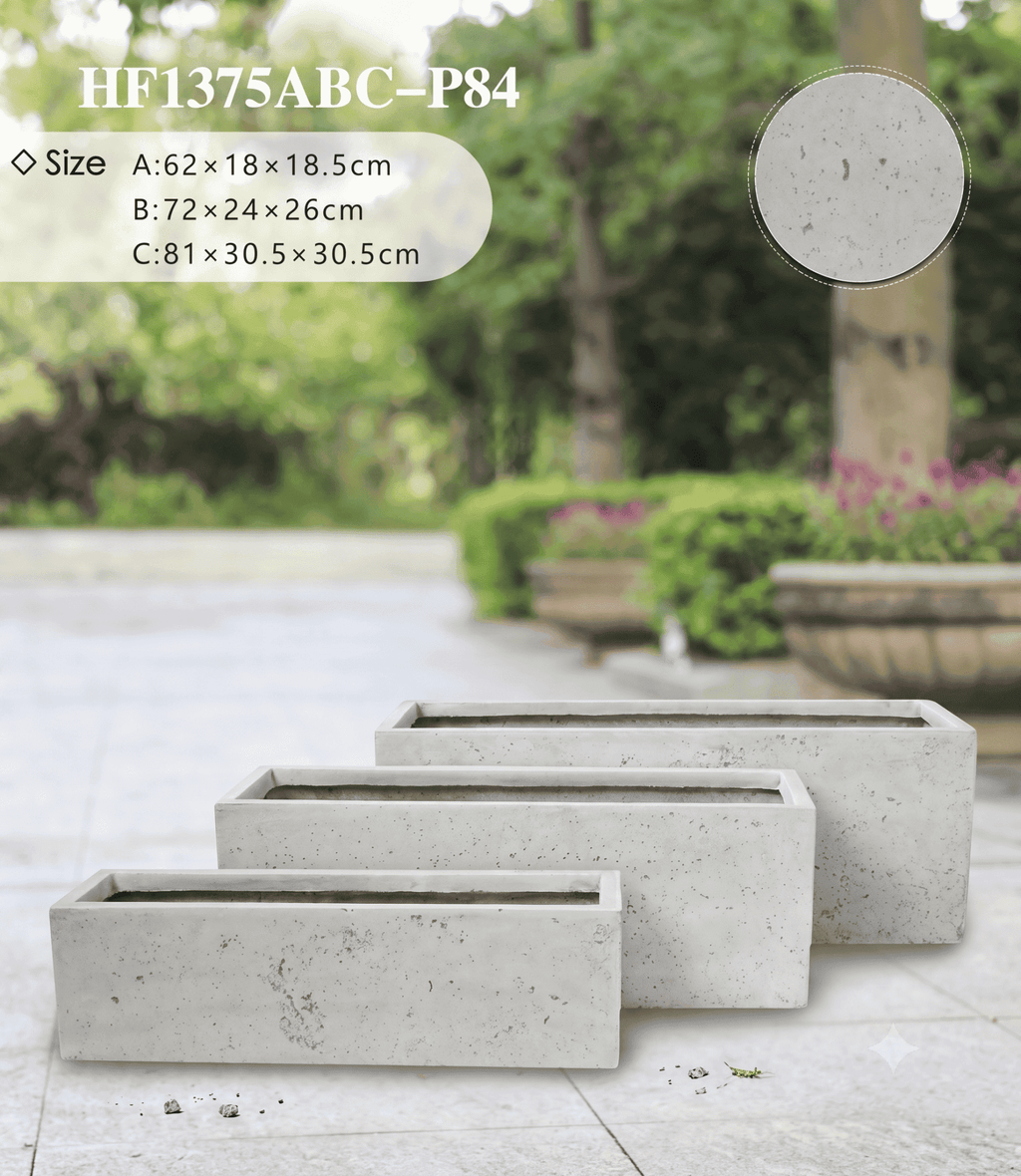 Rectangular shape planter pots arranged neatly along a modern patio boundary