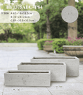 Rectangular shape planter pots arranged neatly along a modern patio boundary