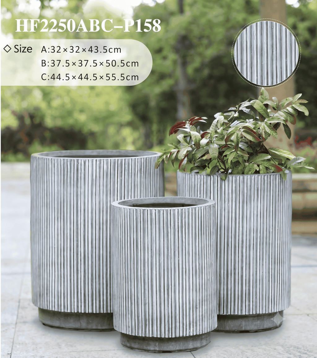 Fluted column planter pots showcasing a sleek vertical pillar design in a modern living room