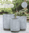 Fluted column planter pots showcasing a sleek vertical pillar design in a modern living room