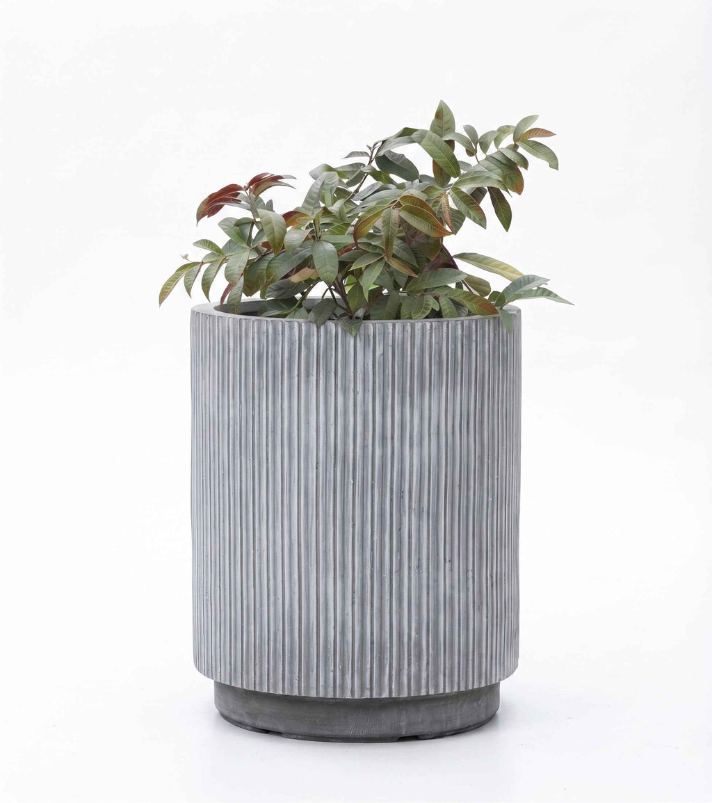 Close-up view of Linear Tube Series fluted column planter pots designed for contemporary plant styling