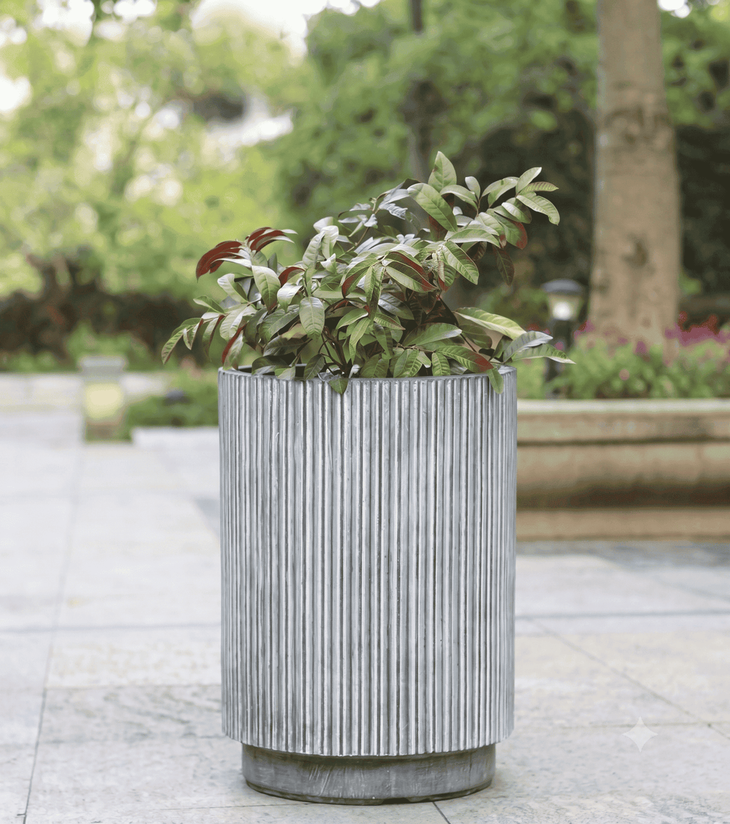 Durable fluted column planter pots styled elegantly on a bright patio deck