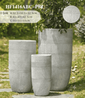 Three gray textured planters of different sizes on a grassy background