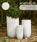 Three textured planters of different sizes in a garden setting with product details.