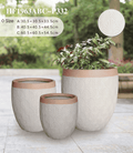 Egg shaped planter pots featuring a stylish two-tone textured finish in a modern living space