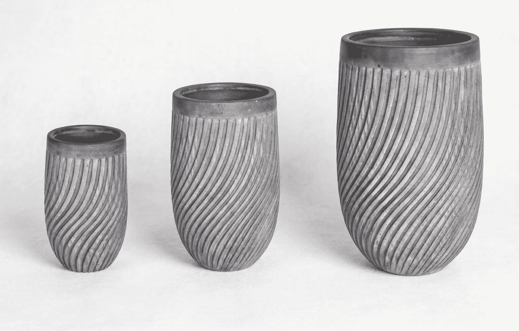 Close-up view of Vortex Series spiral textured planter pots designed for contemporary plant styling